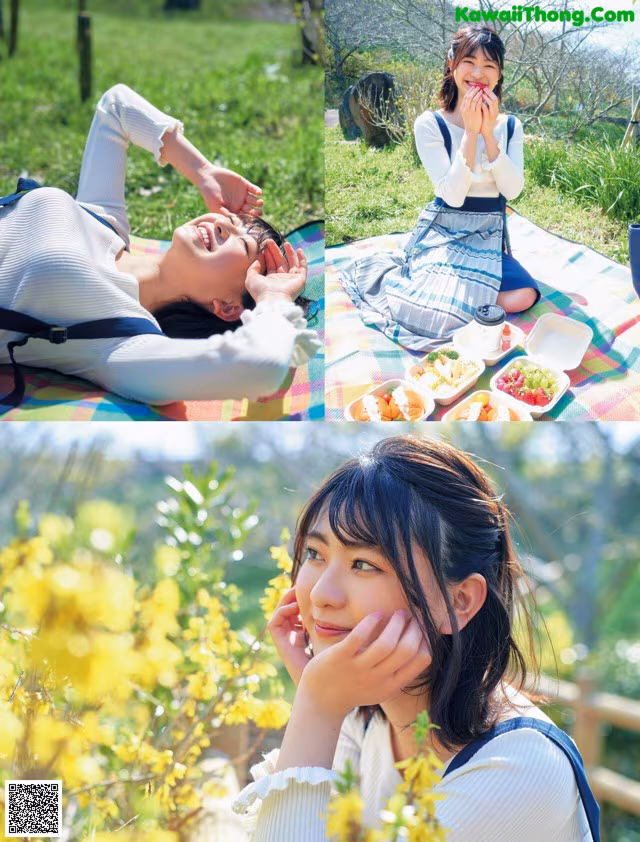 A woman laying on a blanket in a field of flowers.
